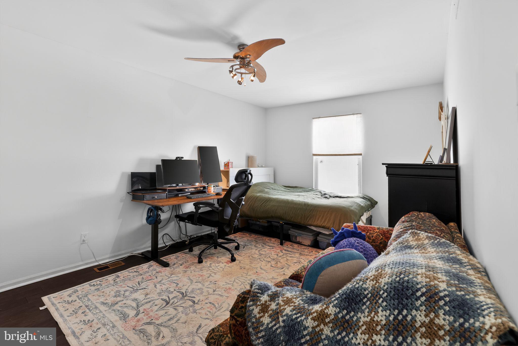 1997 Sunrise Way Jamison, PA 18929 - Photo 18 of 38 a bedroom with a bed and a chandelier