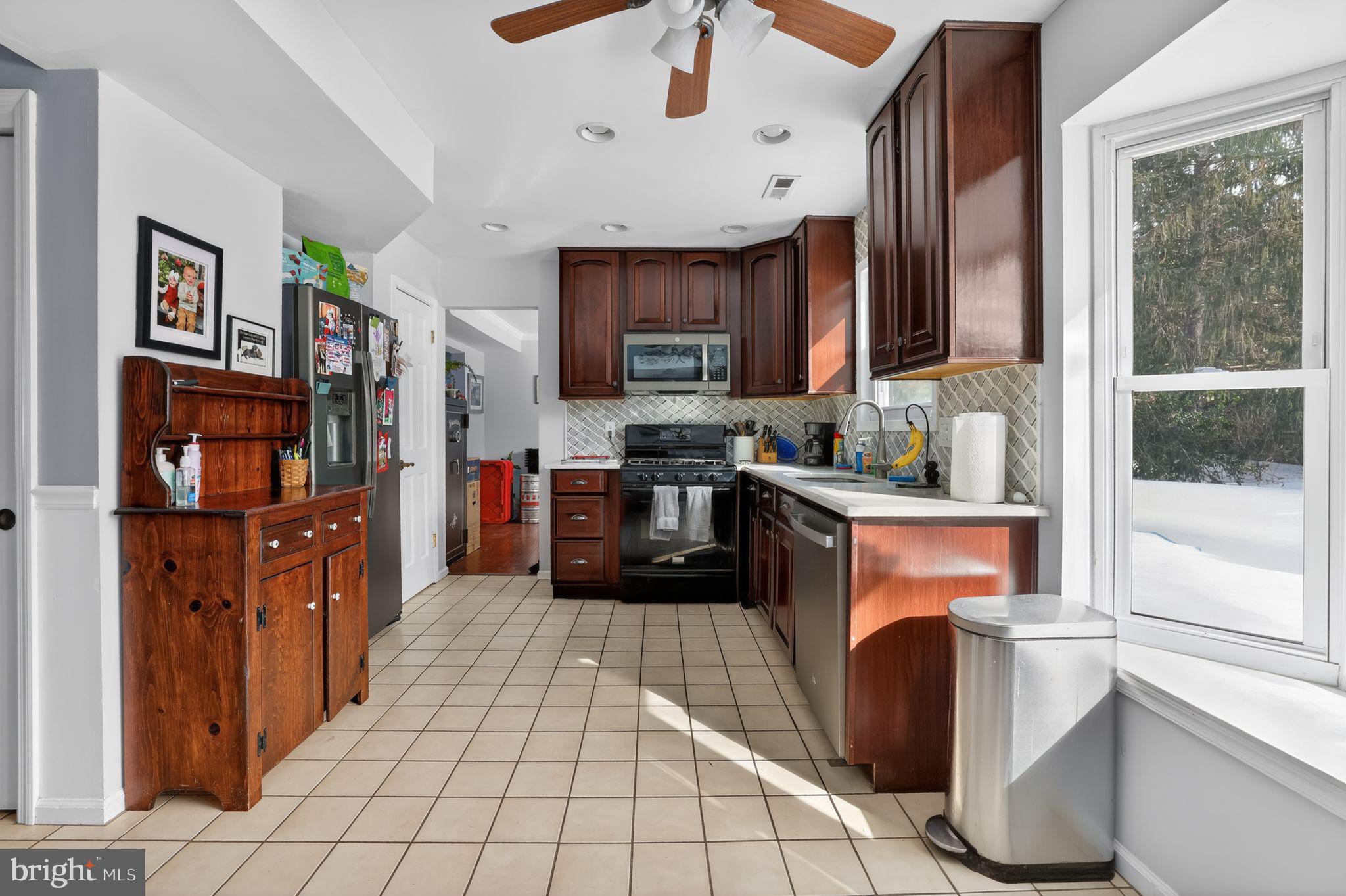 1997 Sunrise Way Jamison, PA 18929 - Photo 8 of 38 a kitchen with stainless steel appliances granite countertop a refrigerator and a stove