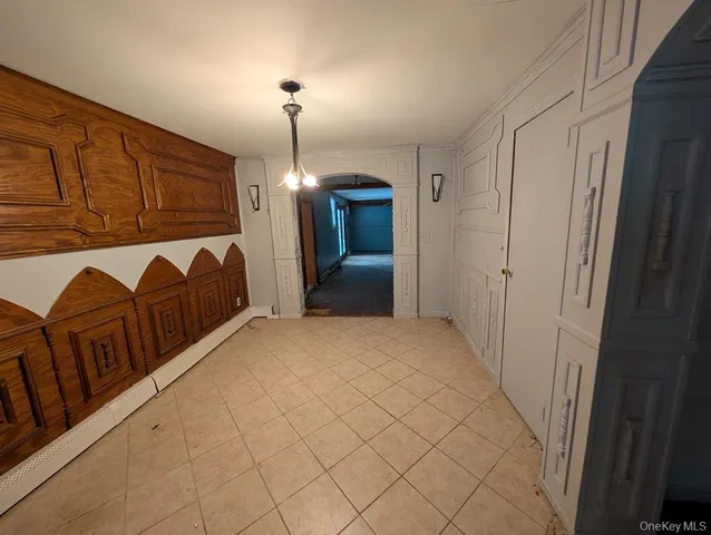 a view of a livingroom with furniture and chandelier