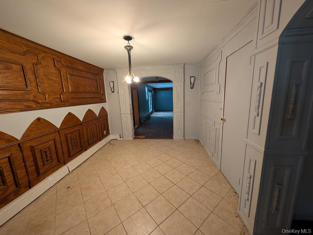 469 Eatontown Road Port Jervis, NY 12771 - Photo 4 of 10 a view of a livingroom with furniture and chandelier