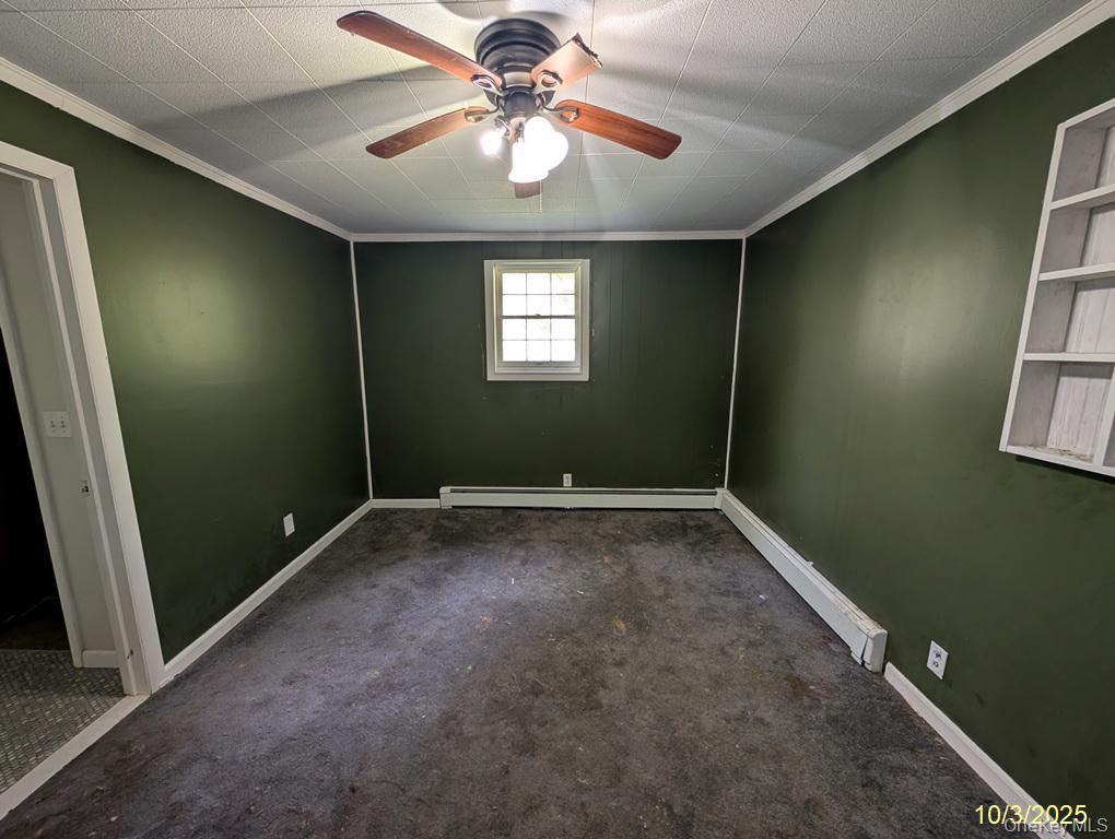 469 Eatontown Road Port Jervis, NY 12771 - Photo 8 of 10 en empty room with windows and fan