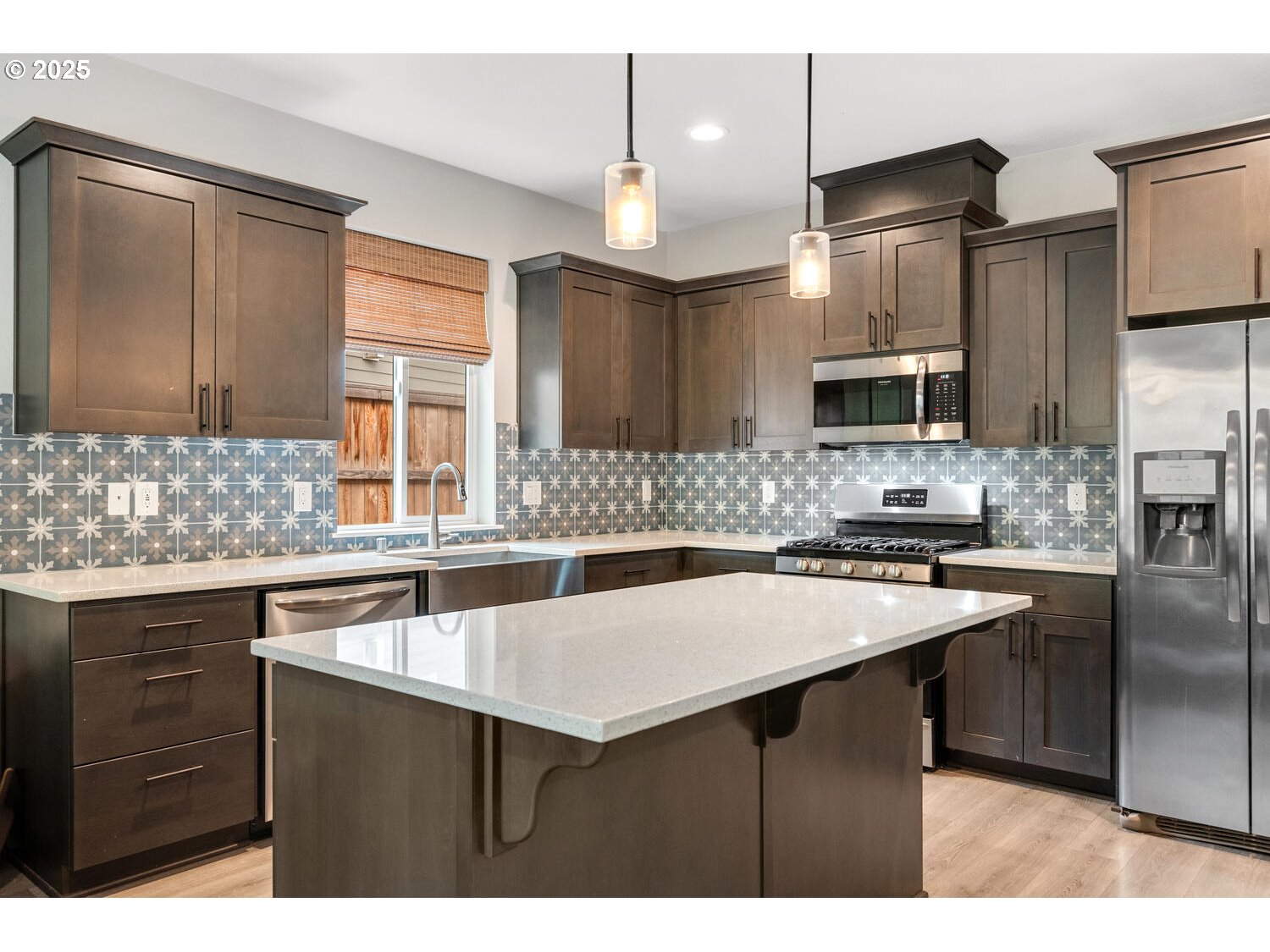 1809 Northeast 169th Street Ridgefield, WA 98642 - Photo 14 of 47 a kitchen with granite countertop a sink cabinets and stainless steel appliances