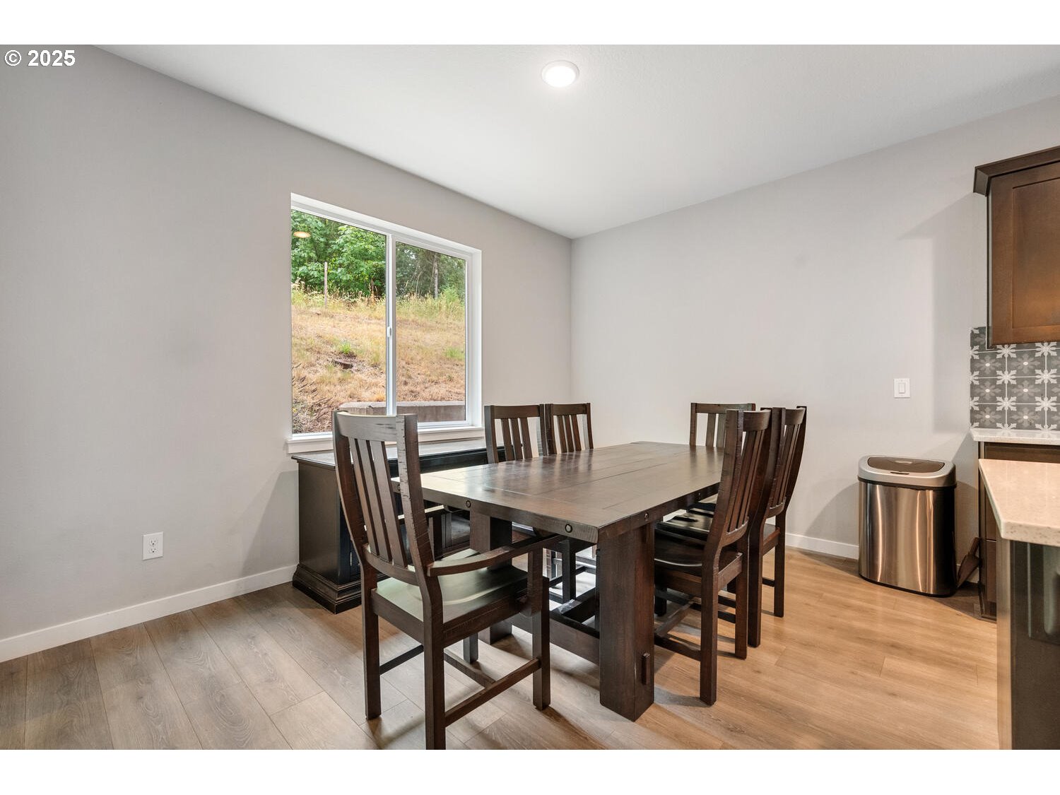 1809 Northeast 169th Street Ridgefield, WA 98642 - Photo 21 of 47 a view of a dining room with furniture and wooden floor