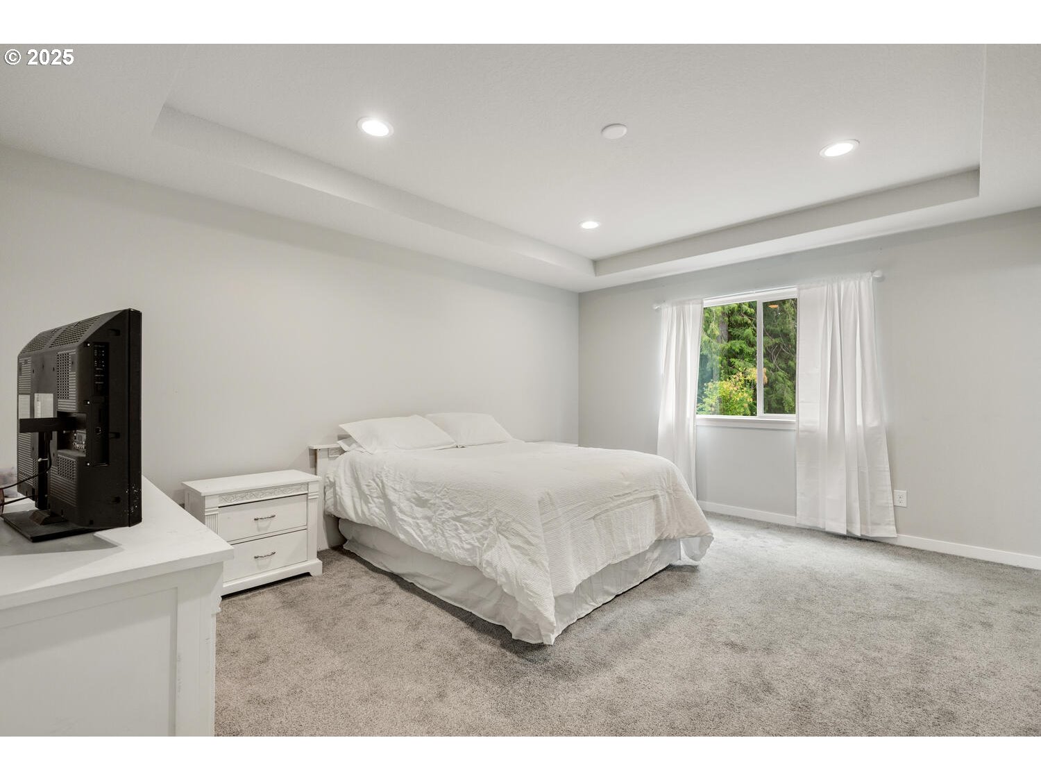 1809 Northeast 169th Street Ridgefield, WA 98642 - Photo 26 of 47 a spacious bedroom with a bed and a large window