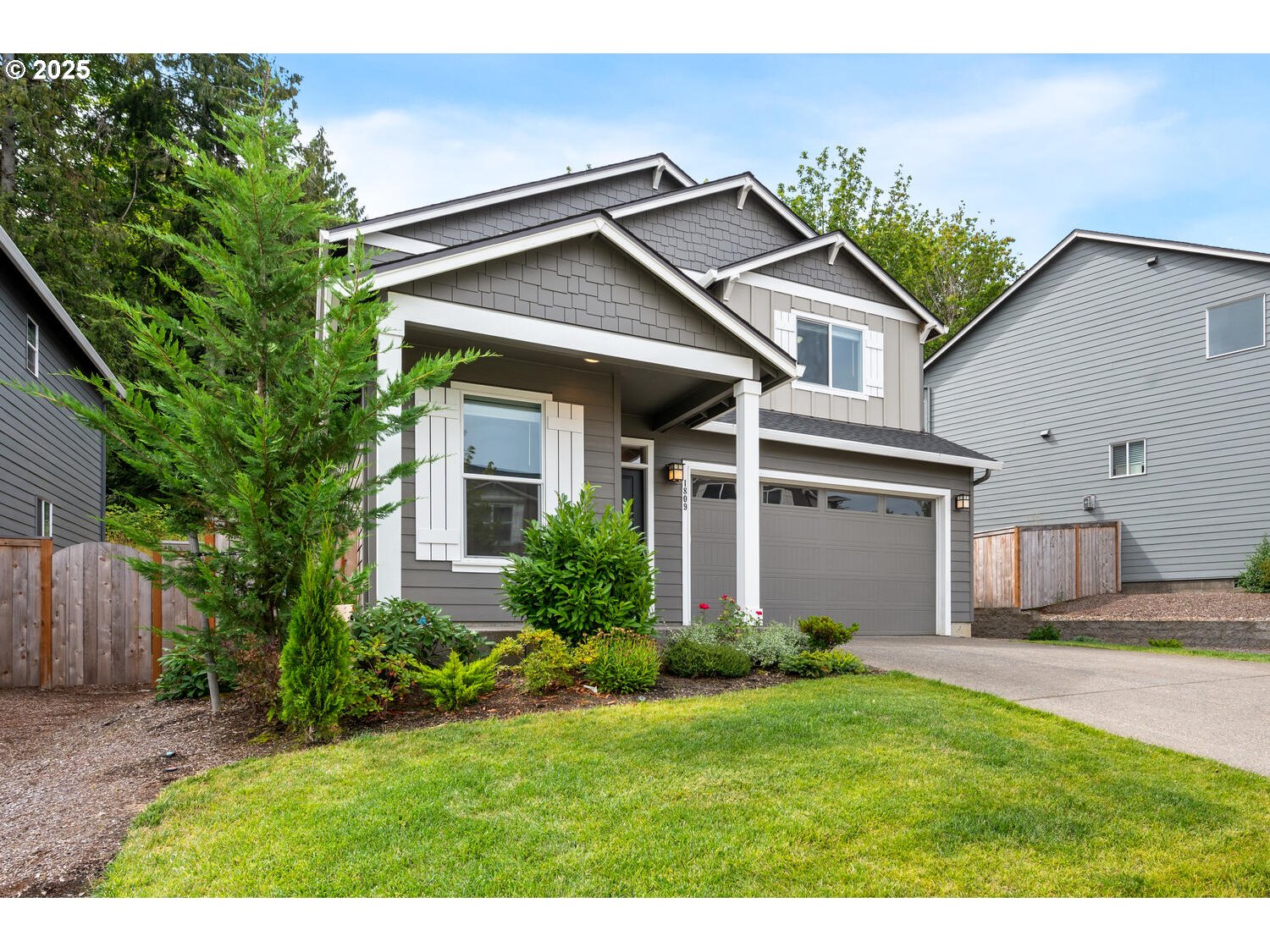 1809 Northeast 169th Street Ridgefield, WA 98642 - Photo 3 of 47 a front view of a house with a yard