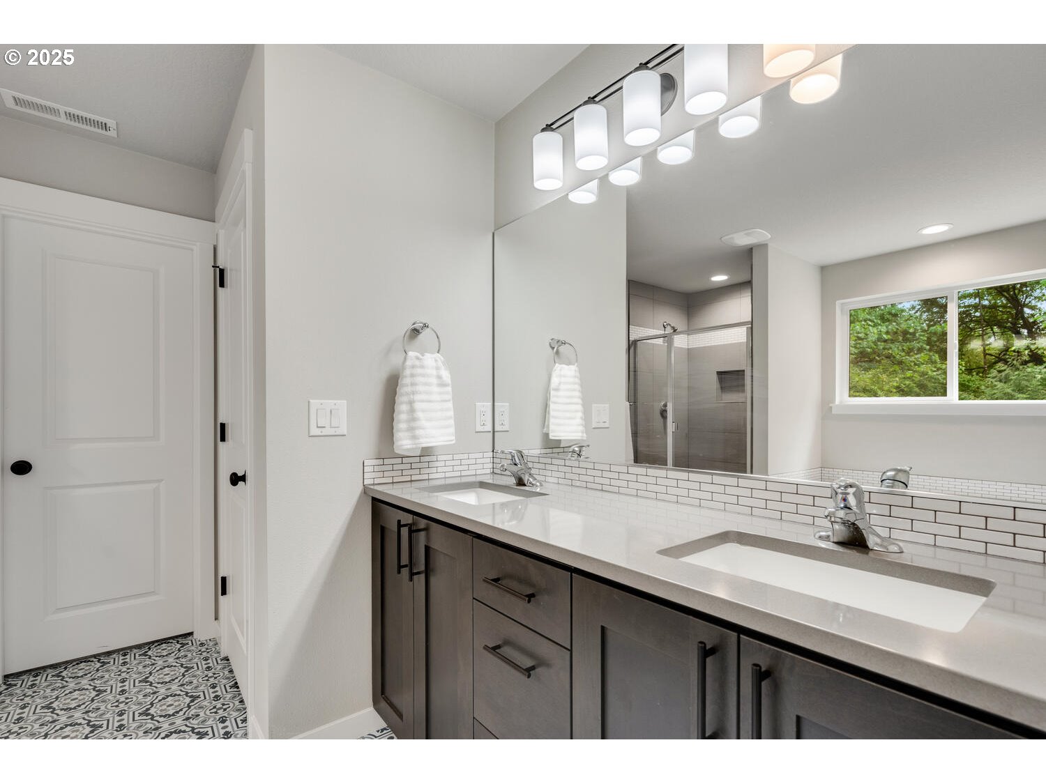 1809 Northeast 169th Street Ridgefield, WA 98642 - Photo 31 of 47 a bathroom with a double vanity sink and a mirror