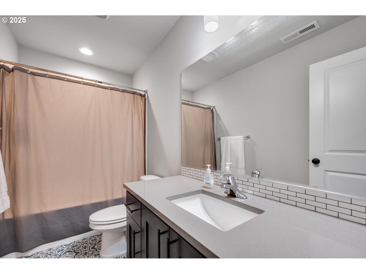 1809 Northeast 169th Street Ridgefield, WA 98642 - Photo 39 of 47 a bathroom with a sink and a mirror