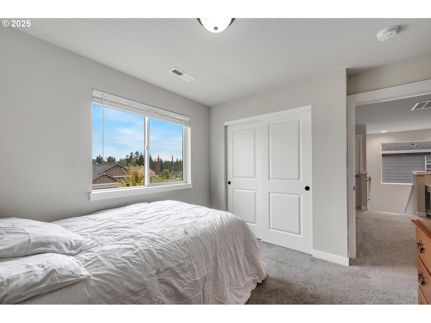 1809 Northeast 169th Street Ridgefield, WA 98642 - Photo 41 of 47 a bedroom with a bed and a large window