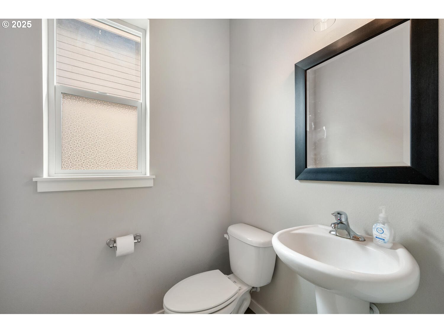 1809 Northeast 169th Street Ridgefield, WA 98642 - Photo 6 of 47 a bathroom with a toilet sink and mirror