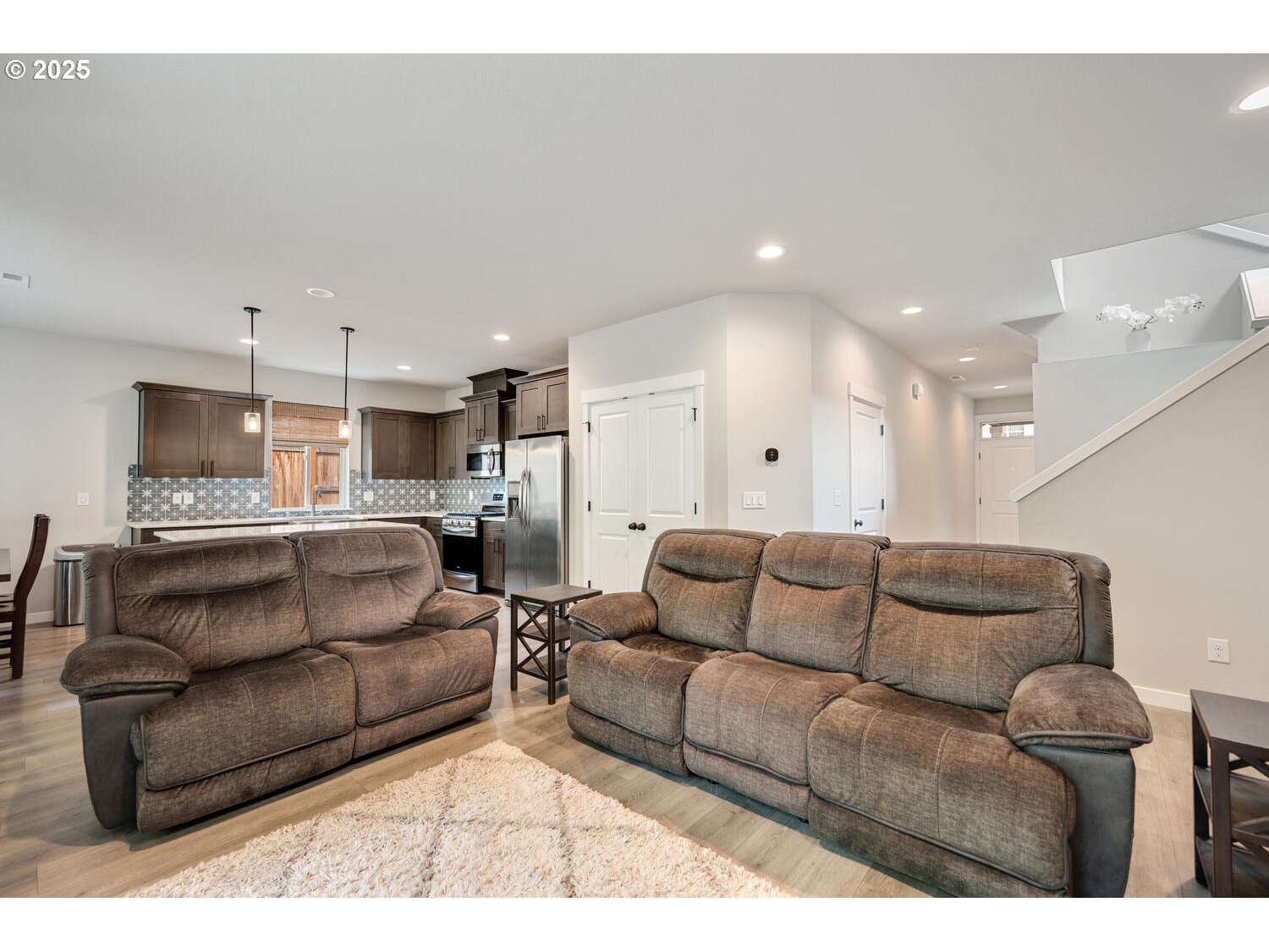 1809 Northeast 169th Street Ridgefield, WA 98642 - Photo 9 of 47 a living room with furniture and kitchen view