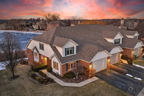 a aerial view of a house with a yard