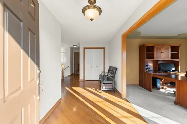 a bedroom with furniture and a window