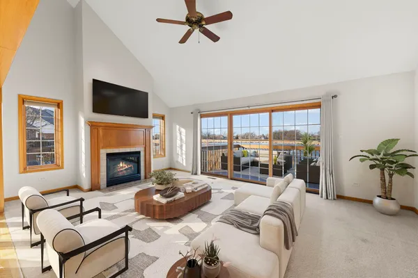 a living room with furniture fireplace and a flat screen tv
