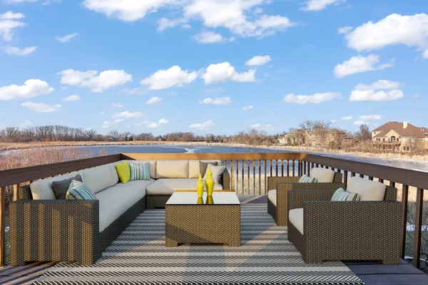 a balcony with wooden floor and city view