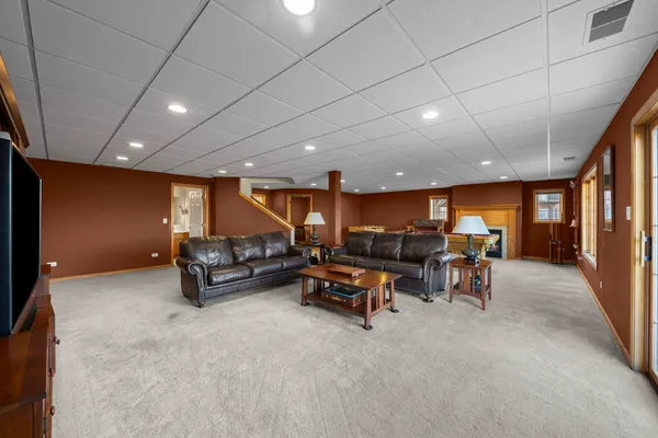 a room with pool tables and windows