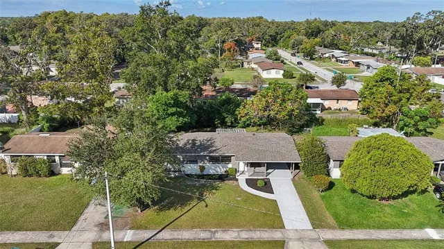 an aerial view of a house with a garden