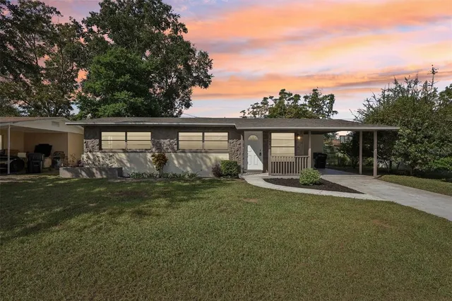 front view of a house with a garden