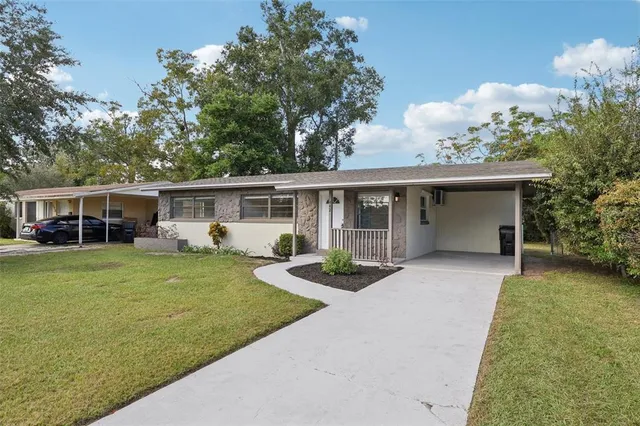 front view of a house with a garden