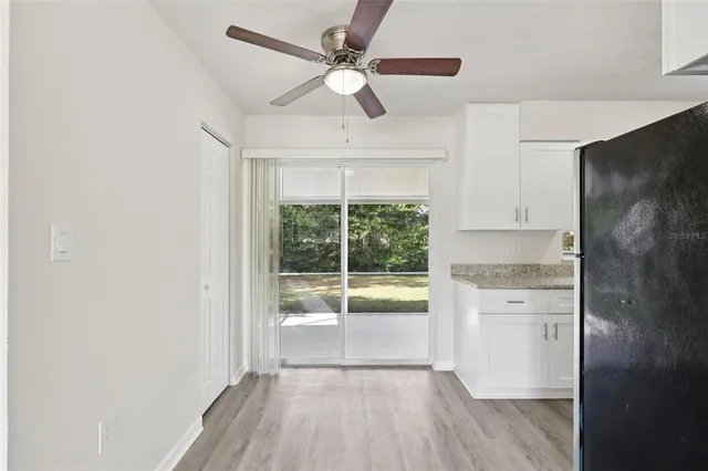 a room with wooden floor and window