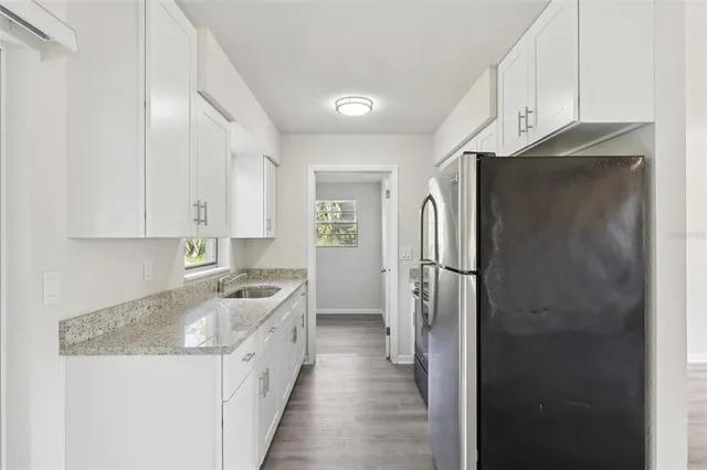 a kitchen with a refrigerator a sink and dishwasher