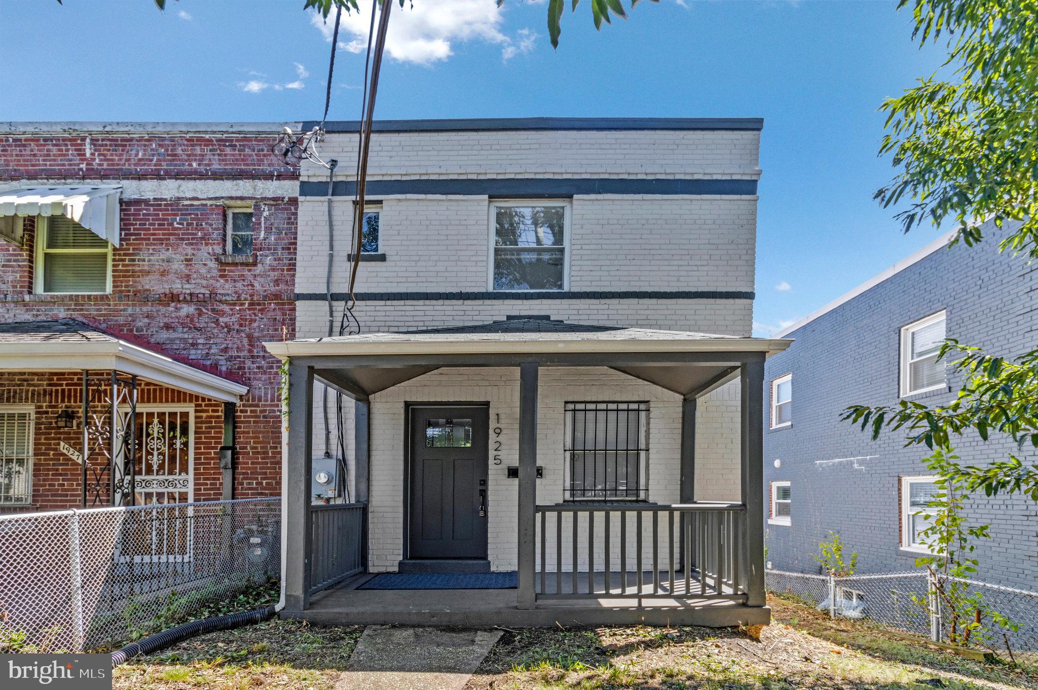 1925 Alabama Avenue Southeast Washington, DC 20020 - Photo 14 of 14 a front view of a house with a porch