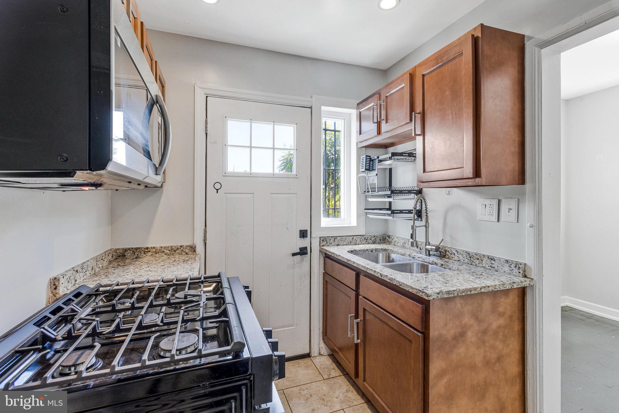 1925 Alabama Avenue Southeast Washington, DC 20020 - Photo 2 of 14 a kitchen with a stove and a sink