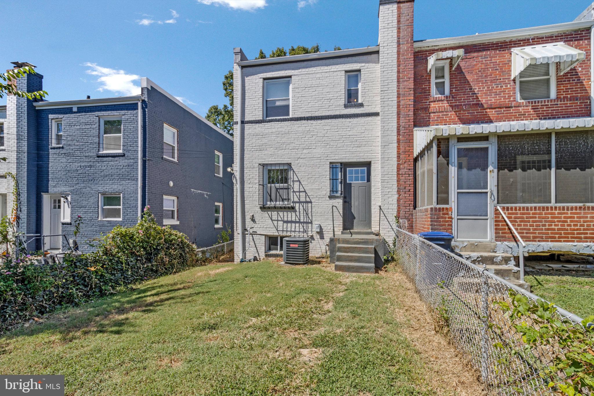 1925 Alabama Avenue Southeast Washington, DC 20020 - Photo 5 of 14 a view of a house with a small yard and wooden fence