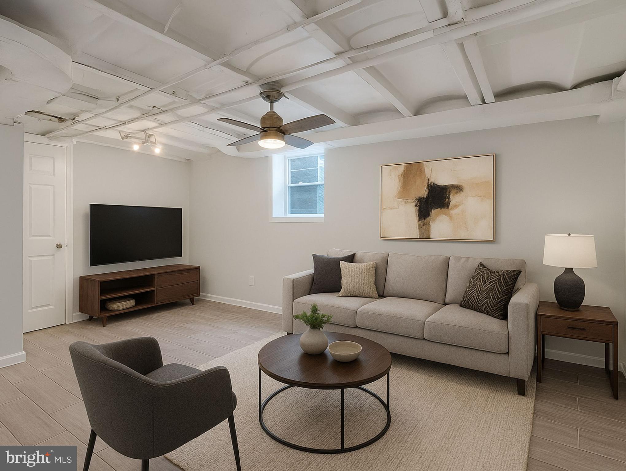 1925 Alabama Avenue Southeast Washington, DC 20020 - Photo 10 of 14 a living room with furniture and a flat screen tv