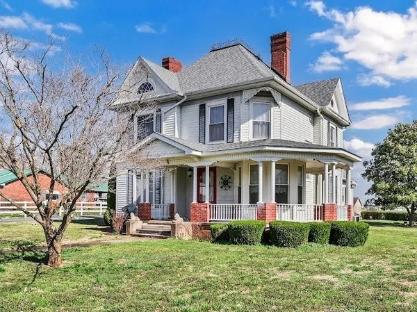 a view of backyard of house with garage