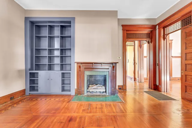 a bathroom with a sink a toilet a mirror and a window