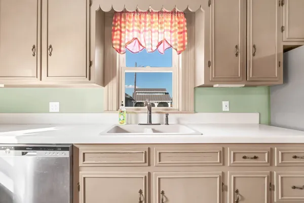 a view of a hallway with wooden floor and stairs