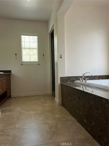 an empty room with a sink