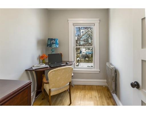 22 Berkeley Street Somerville, MA 02143 - Photo 12 of 28 a workspace with furniture and a window