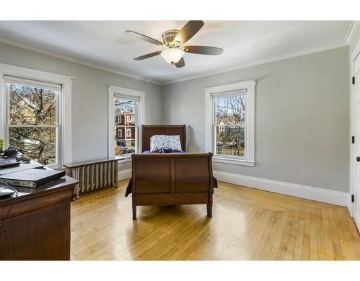 22 Berkeley Street Somerville, MA 02143 - Photo 13 of 28 a living room with furniture and windows