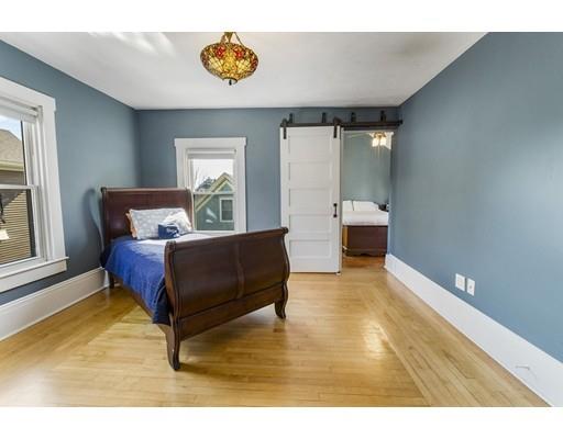 22 Berkeley Street Somerville, MA 02143 - Photo 17 of 28 a living room with a couch and a table