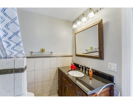 22 Berkeley Street Somerville, MA 02143 - Photo 20 of 28 a bathroom with a sink vanity and a mirror