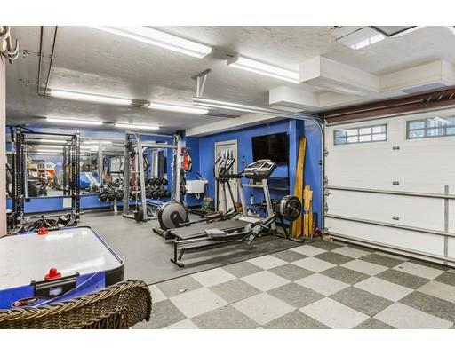 22 Berkeley Street Somerville, MA 02143 - Photo 24 of 28 a living room with gym equipment and a view of gym