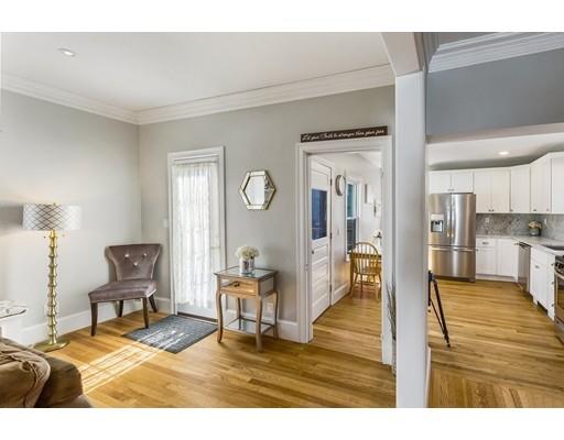 22 Berkeley Street Somerville, MA 02143 - Photo 4 of 28 a living room with furniture and a table