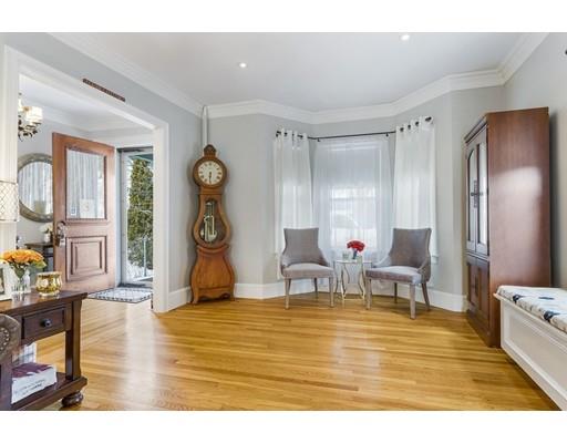 22 Berkeley Street Somerville, MA 02143 - Photo 6 of 28 a living room with furniture and a table