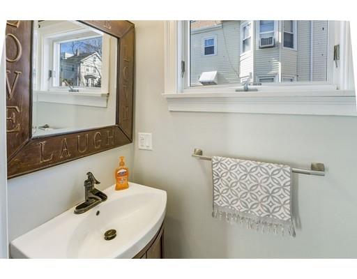 22 Berkeley Street Somerville, MA 02143 - Photo 10 of 28 a bathroom with a sink and a mirror