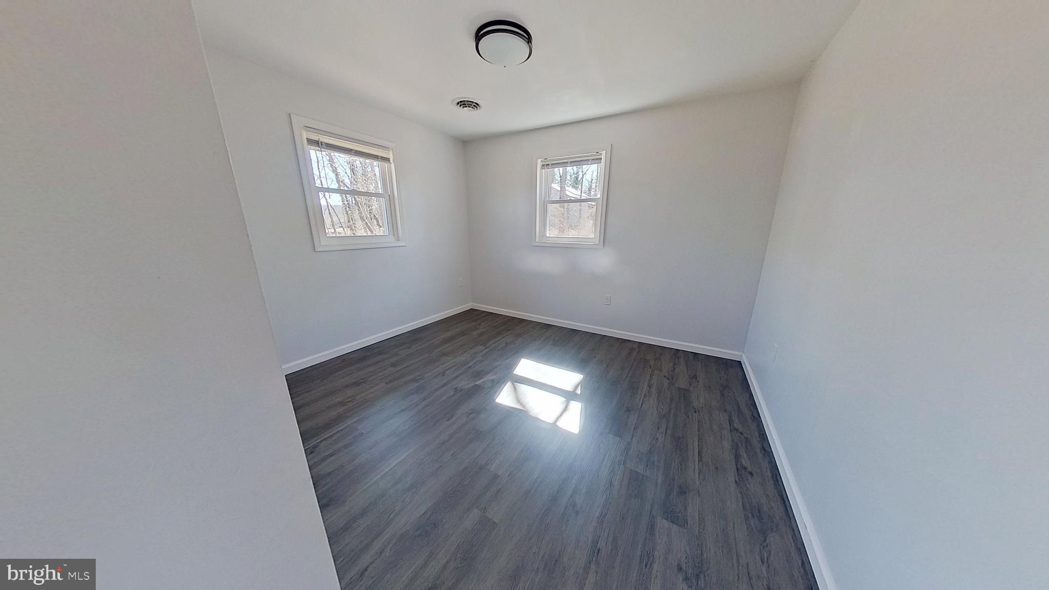 1821 Detters Mill Road Dover, PA 17315 - Photo 4 of 9 wooden floor in an empty room with a window