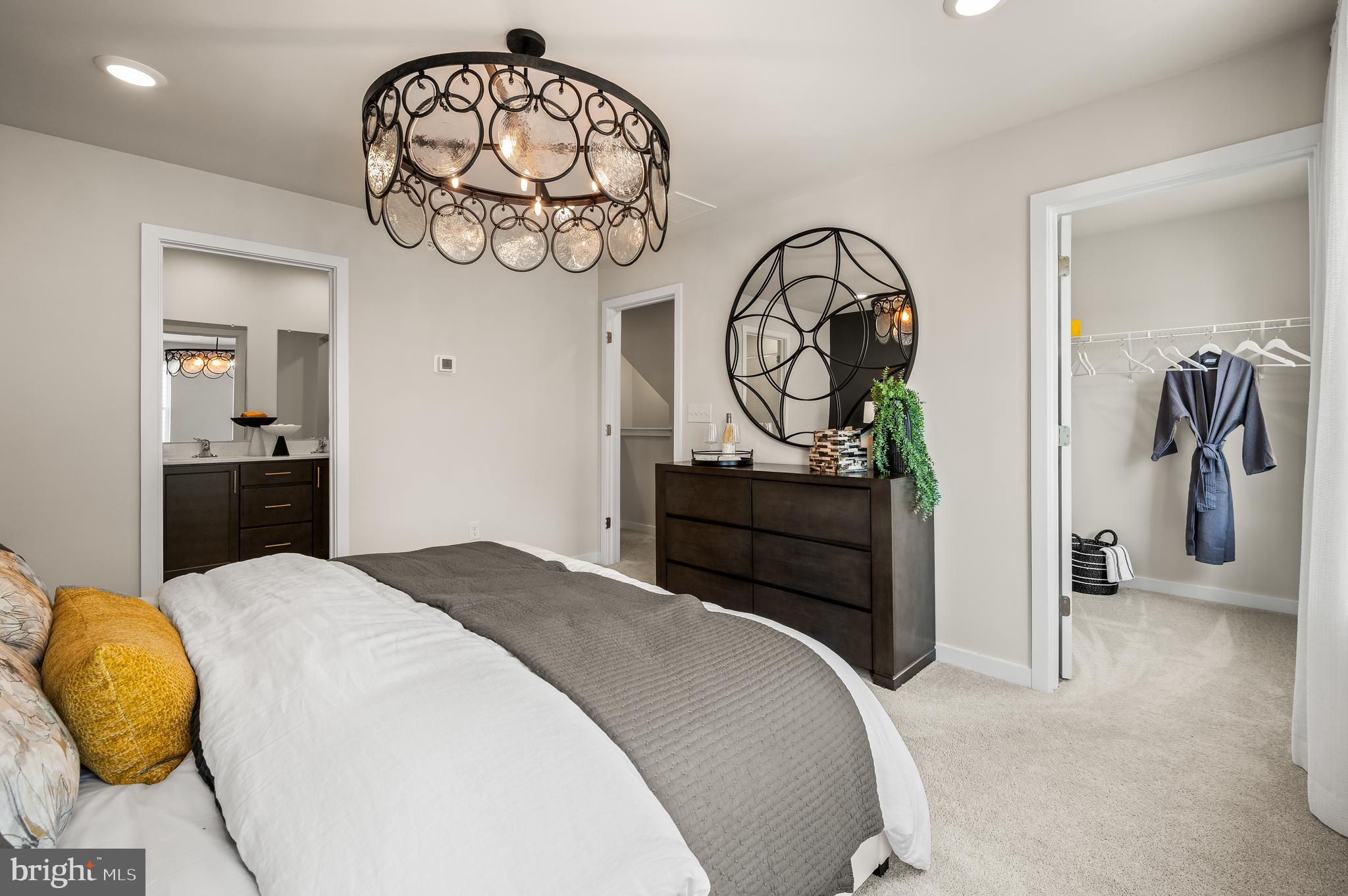 27 Atkins Drive Bridgeport, PA 19405 - Photo 25 of 35 a bedroom with a bed and a chandelier