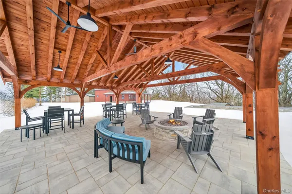 a view of a patio with a table and chairs
