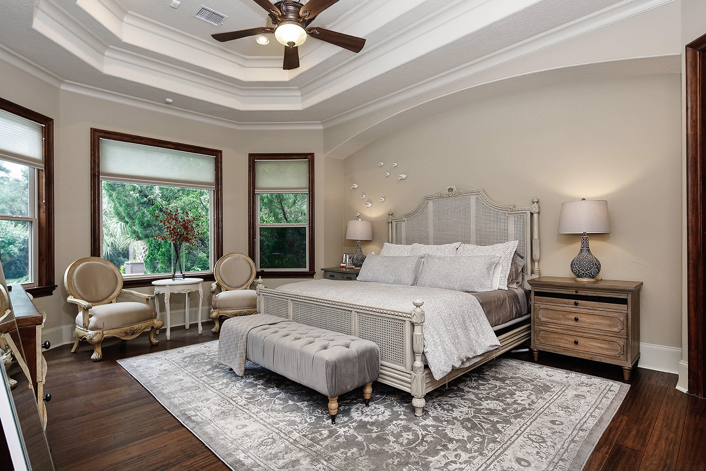 119 Angel Leaf Road The Woodlands, TX 77380 - Photo 26 of 50 a bedroom with a bed wooden floor and windows