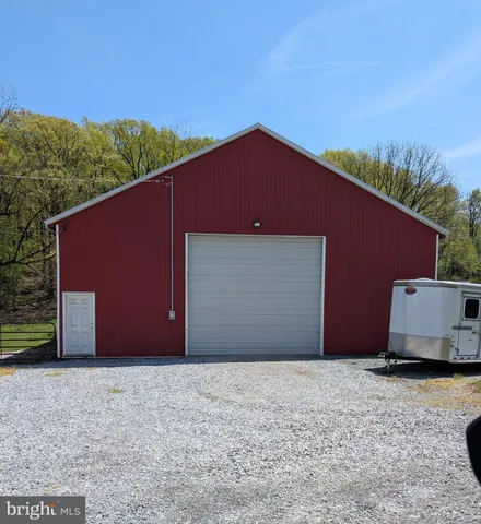 a view of a park with large trees