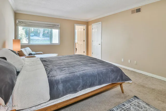 a bathroom with a sink double vanity and a mirror