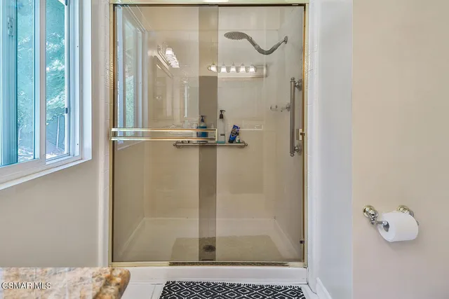 an empty room with painting on the wall