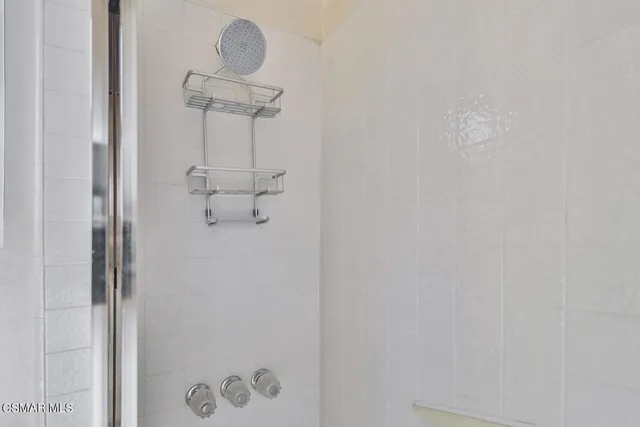 swimming pool view with a seating space and a garden view