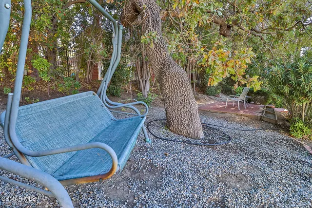 aerial view of a house with yard and furniture