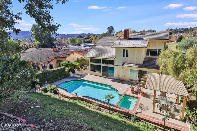 a view of a street with wooden fence